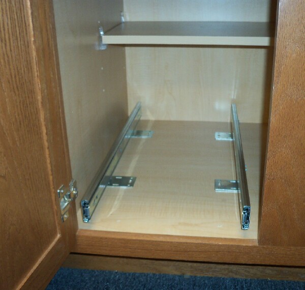 Full extension "L" brackets in position for base installation of pullout/rollout shelves